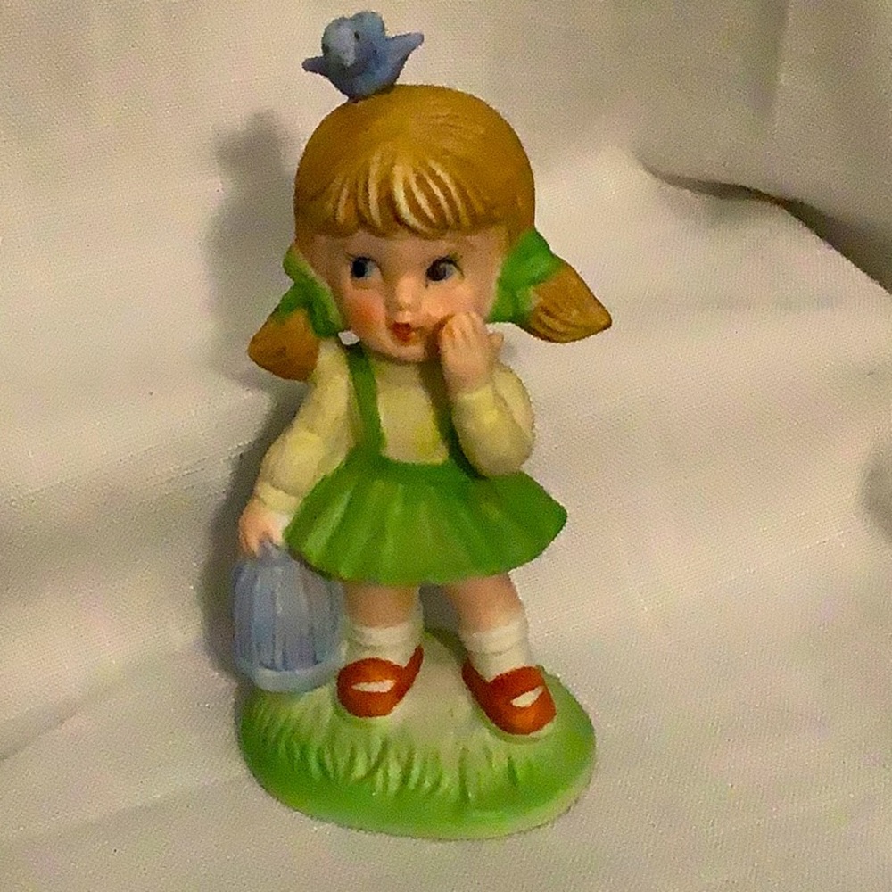 Homco porcelain girl w/bird on head holding birdcage  Vintage